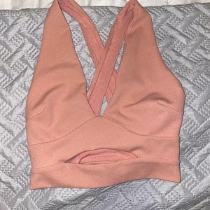 Pink crop top with cut out in stomach